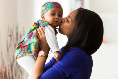 mother kissing her child