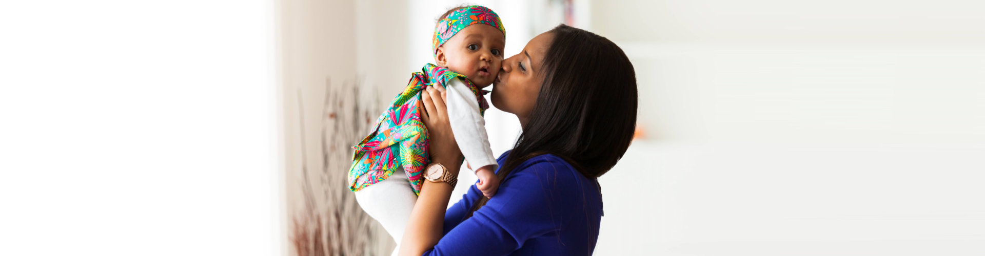 mother kissing her child